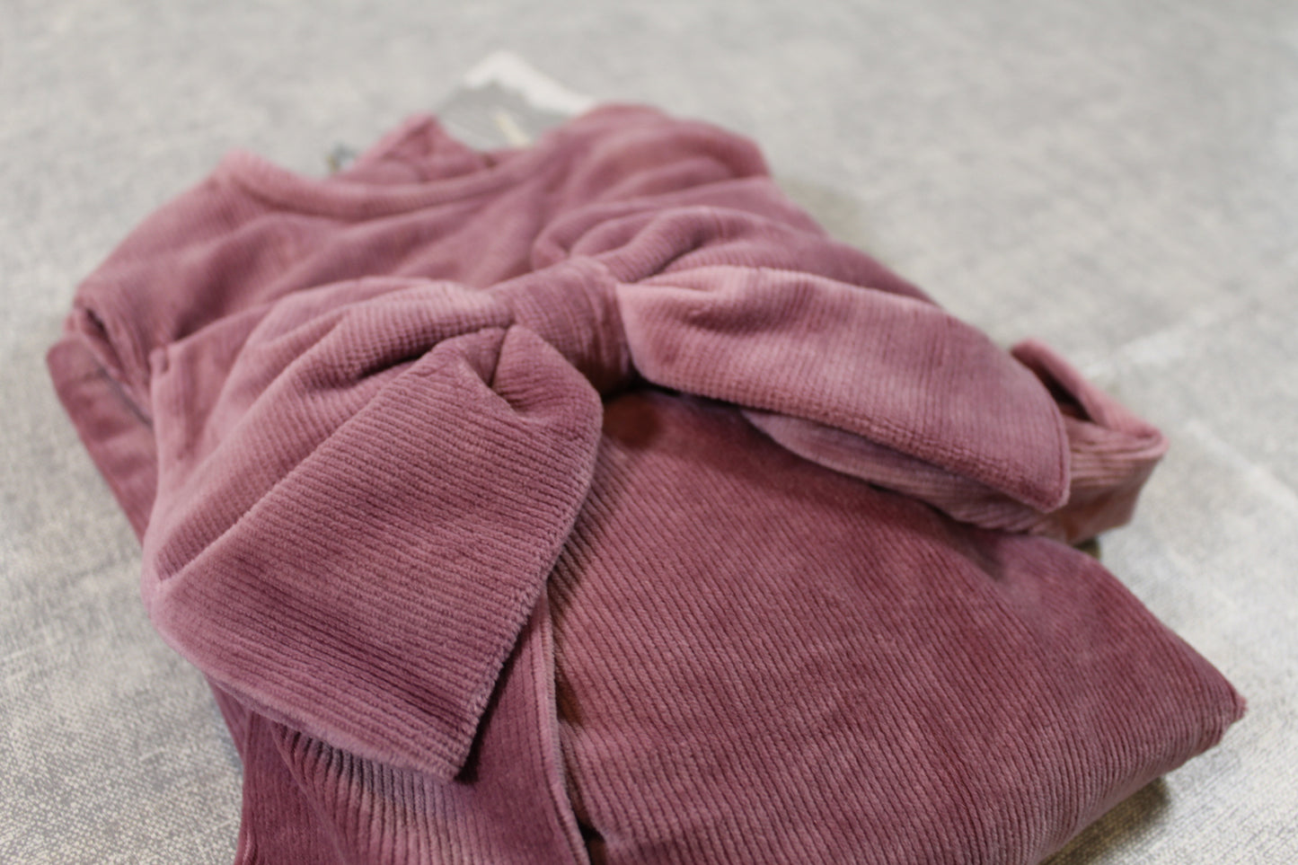 kuscheliges zartrosanes Kleid mit Schleife 98/104