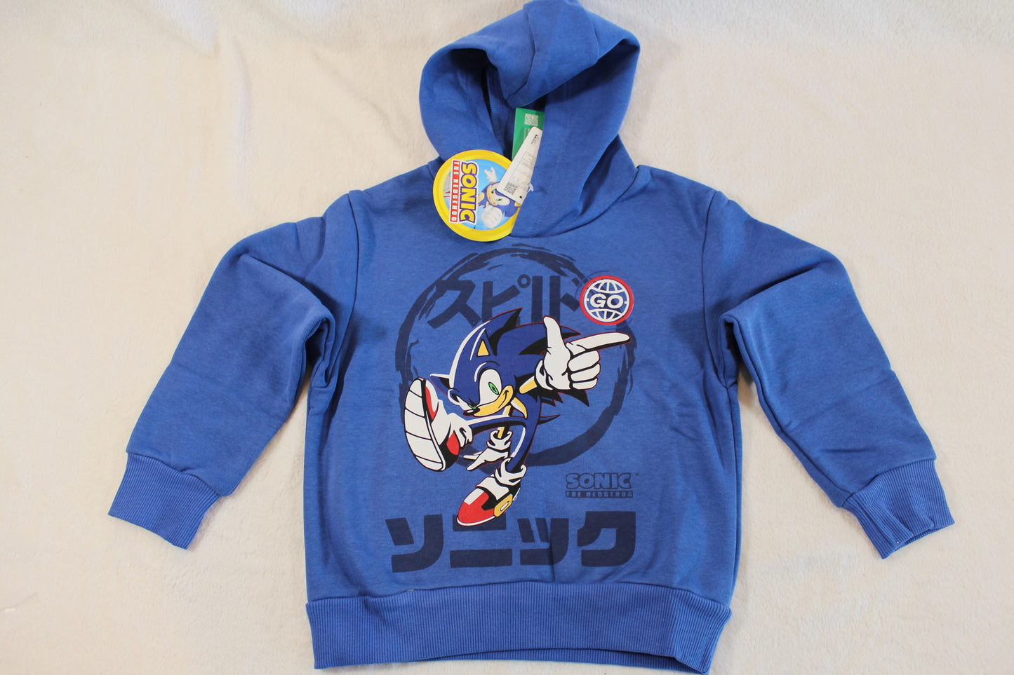 Blue hooded sweatshirt featuring a dynamic Sonic the Hedgehog graphic and Japanese text, branded as 110/116 Pullover Sonic, ideal for casual wear.