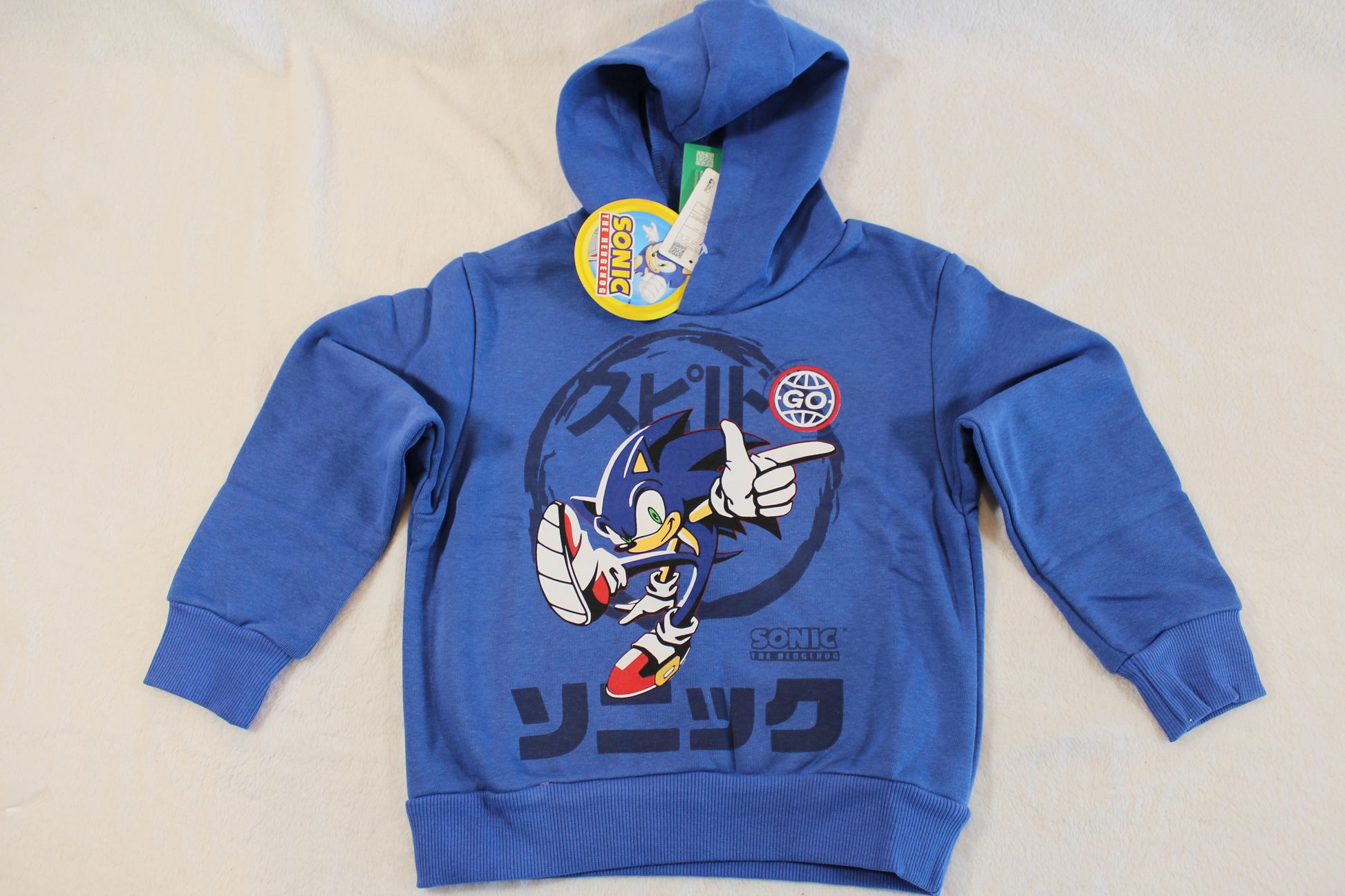 Blue hooded sweatshirt featuring a dynamic Sonic the Hedgehog graphic and Japanese text, branded as 110/116 Pullover Sonic, ideal for casual wear.