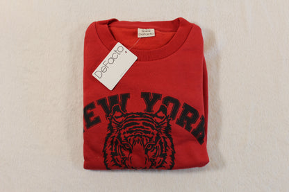 Red pullover with a tiger graphic and "New York" text folded neatly, featuring a DeFacto brand tag, named 140/146 Tiger Style Pullover.