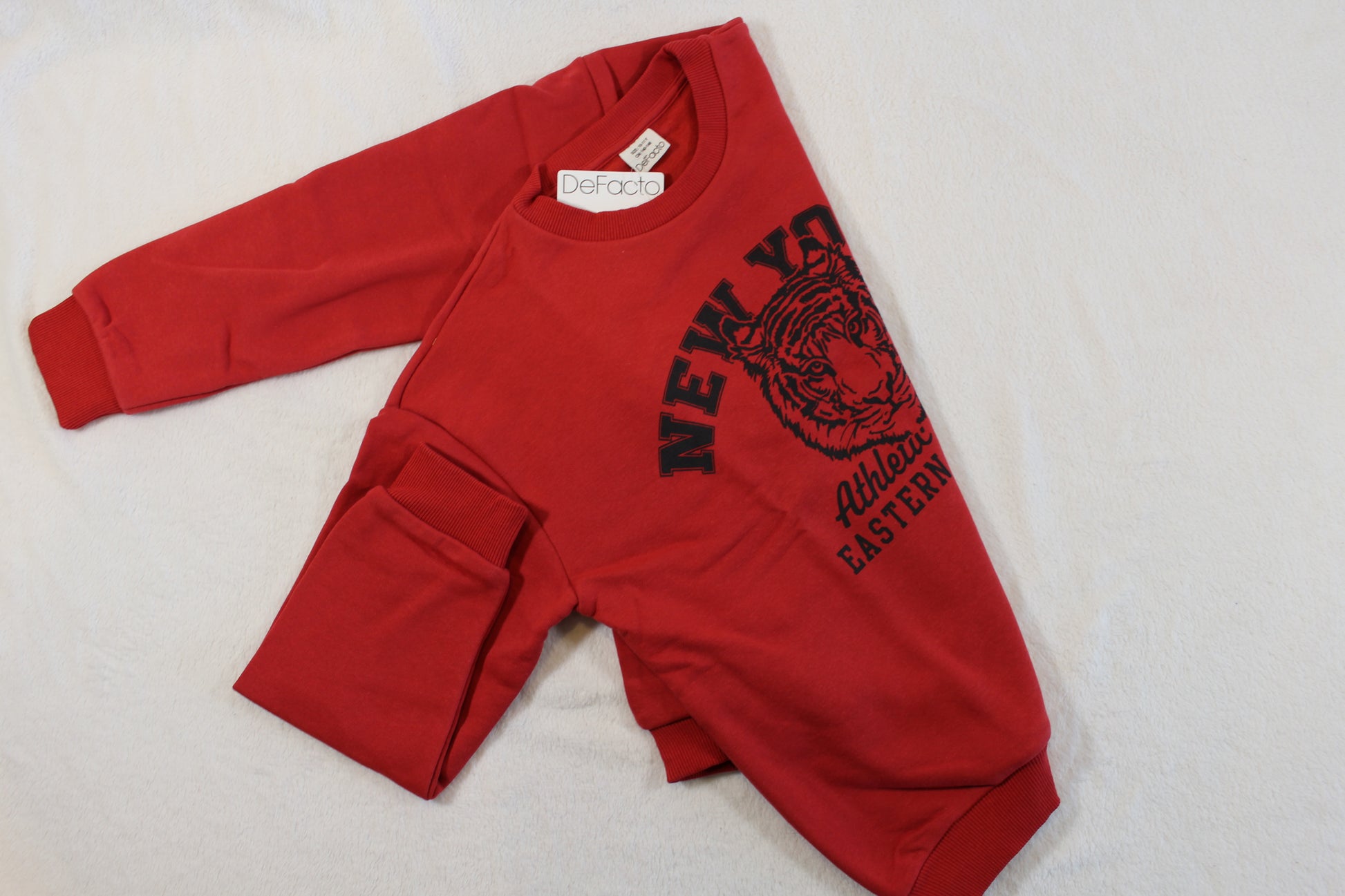 140/146 Tiger Style Pullover in red with black tiger graphic and athletic-themed text, laid flat on a white background, showcasing casual sporty design.