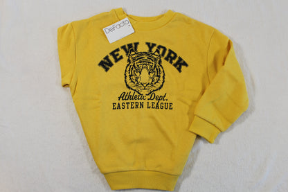 Yellow pullover with tiger graphic and "New York Athletic Dept. Eastern League" text, featuring long sleeves and ribbed cuffs, 110/116 Tiger Style Pullover.