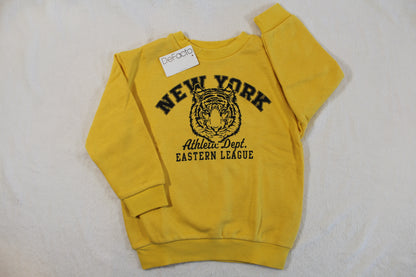 110/116 Tiger Style Pullover in yellow with black New York and tiger graphic on the front, featuring long sleeves and a crew neck style.