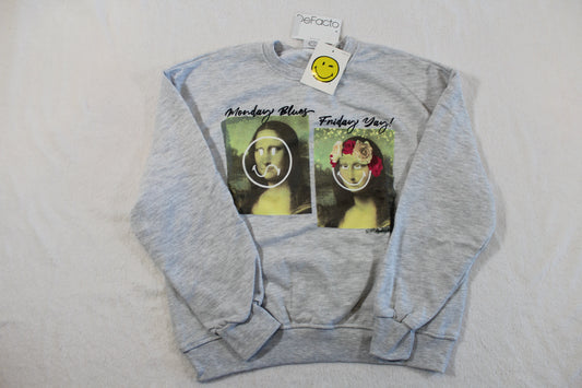134/140 Monalisa Style Pullover in light gray featuring two modified Mona Lisa prints with playful smiley face graphics and text on the front.